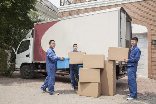 Office furniture being moved through a narrow access point