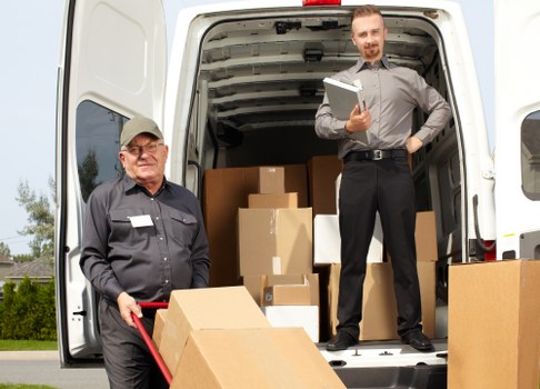 House removalists planning a move in Finsburypark with packed boxes and a moving van