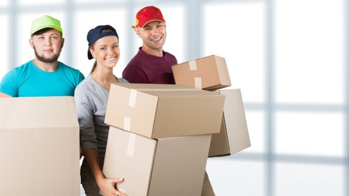 Local moving team handling bulky furniture in North London