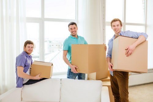 Trained removal staff handling furniture with care in Finsbury Park