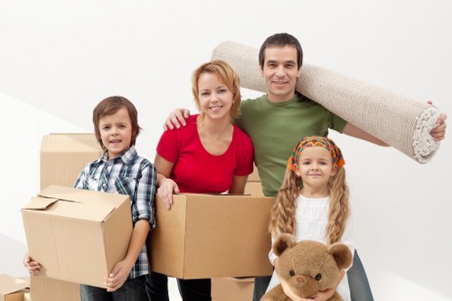 Movers carrying furniture through an apartment building