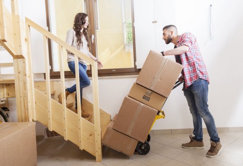 Specialist movers preparing a piano for transport
