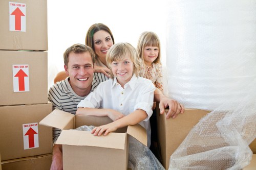 Professional movers handling furniture in a busy urban area